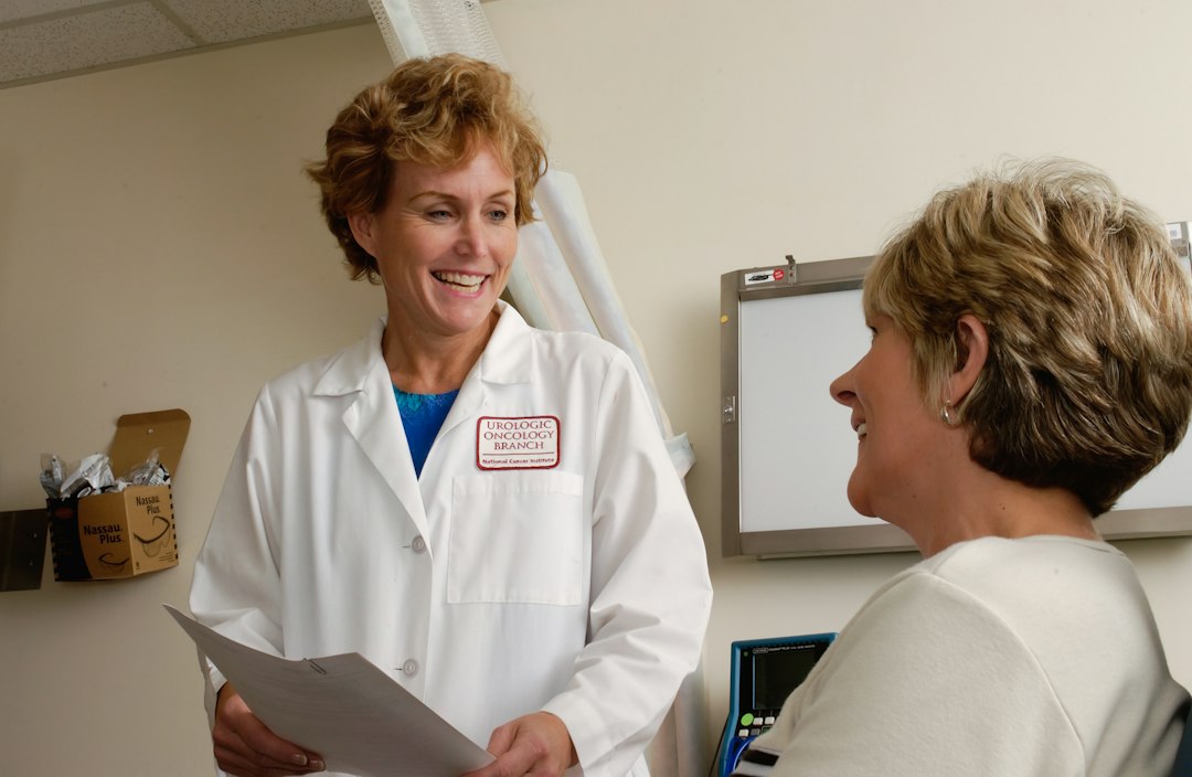 Healthcare professional meeting with a patient during a medical evaluation